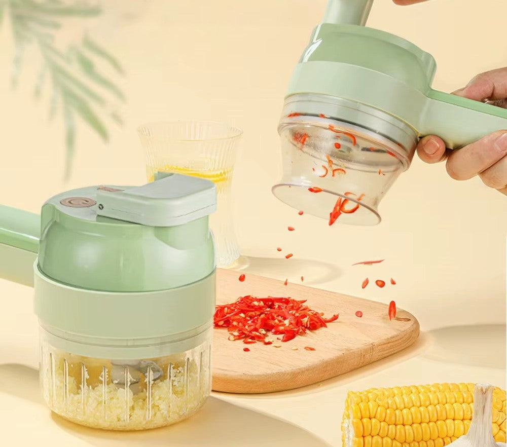 SnapPrep electric chopper mincing garlic while a second unit slices red chili onto a cutting board
