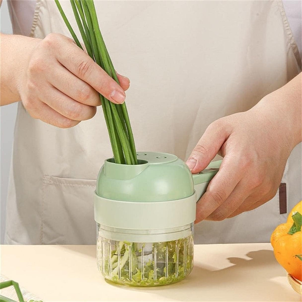 Scallions dropping in even slices from the SnapPrep into a bowl