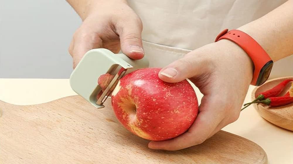 Peeling a red apple with the SnapPrep peeler head