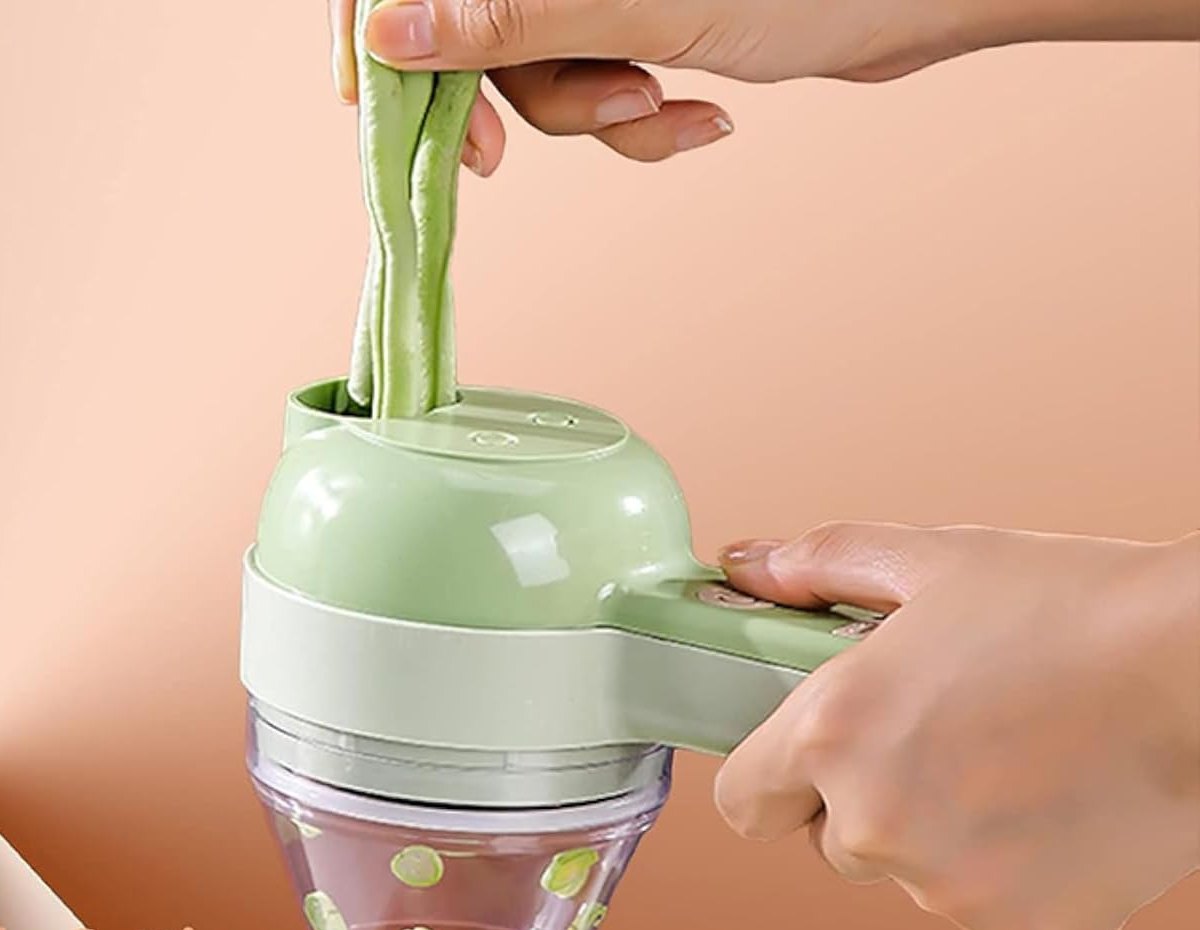 Scallions being sliced directly into the SnapPrep cup